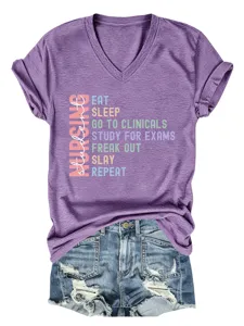 Detailed view of the purple V-neck short sleeve nursing student graphic t-shirt and denim shorts.