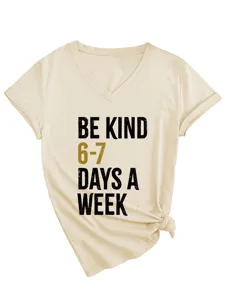 Beige v-neck short sleeve t-shirt detail showing front printed quote and hem knot design.