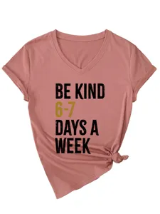 Close-up detail of the pink v-neck t-shirt featuring chic front knot hem and stylish print.