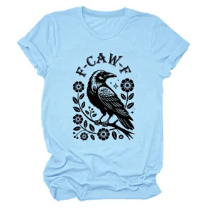 Close-up detail of the light blue women's t-shirt featuring a stylish black raven floral graphic print.