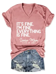 Pink V-neck short sleeve t-shirt with letter print and rolled cuffs with denim shorts.