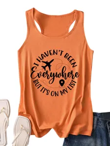 Close-up detail of the orange women's tank top featuring a travel quote graphic print.