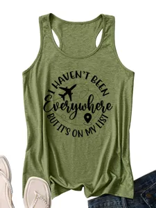 Close up detail of women green racerback tank top with travel theme black quote print.