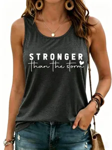 Casual minimalist women's racerback tank top featuring stronger than the storm text print.