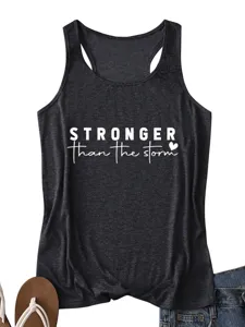 Close-up detail of women casual black racerback tank top featuring white motivational storm quote print.