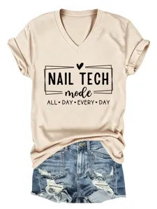 Beige V-neck short sleeve t-shirt featuring a stylish nail tech graphic print paired with denim shorts.