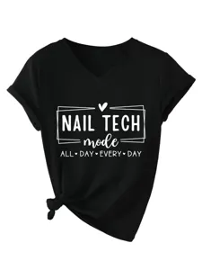 Detail view of black V-neck t-shirt featuring nail tech graphic print and knot hem.