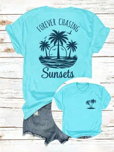 Detailansicht Damen lässiges Grafik T-Shirt mit Palmen Sonnenuntergang Druck Rundhals blau.