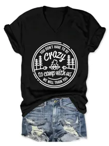 Detail shot of casual women black V-neck short sleeve t-shirt with funny camping graphic print.