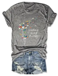 Casual gray short-sleeve T-shirt featuring creative book dandelion graphic and reading text.