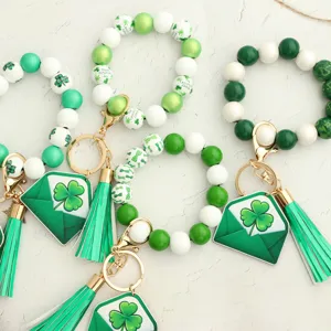 St Patrick's Day beaded wristlet keychain with shamrock charm and tassel details for festival.
