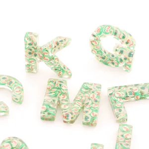 Christmas resin letter keychain with cute polymer clay slices, festive holiday bag pendant.
