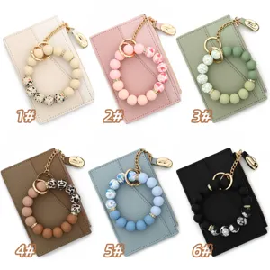 Details of stylish silicone bead wristlet wallet card holders in six variant colors for daily use.