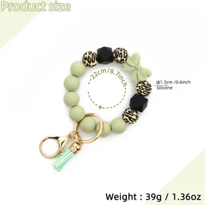 Silicone beaded keychain bracelet with bow leopard print tassel cute accessory for women bags.
