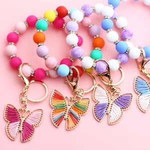 Hermosa pulsera llavero de cuentas de silicona coloridas con colgante de mariposa.