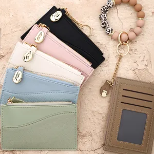 Multifunctional PU leather card holder wallet with zipper coin pocket and beaded wristlet.