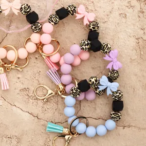 Colorful silicone bead wristlet keychain with cute bow and tassel for women bag charm.