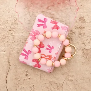 Portefeuille porte-cartes en cuir rose avec motif nœud et porte-clés bracelet perles silicone