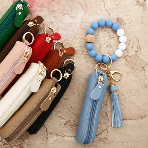 Colorful leather zipper pouch keychain with silicone bead wristlet and tassel charm set.