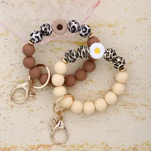 Cute silicone beaded keychain wristlet with floral charm and leopard print design for women.