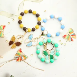 Hermoso llavero de pulsera de cuentas de silicona coloridas con colgante de mariposa