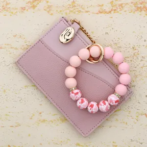 Pink leather card holder with silicone beaded bracelet keychain for women daily use
