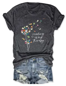 Dark grey short sleeve graphic t-shirt with book dandelion print and casual denim shorts.