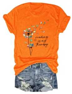 Orange short sleeve t-shirt with book dandelion graphic and reading quote, casual top.