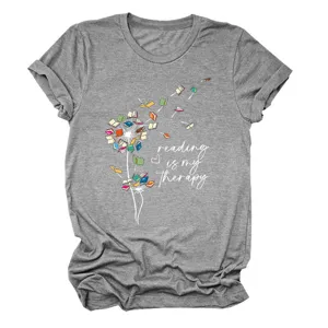 Grey short sleeve women t-shirt featuring creative book dandelion graphic and reading slogan.