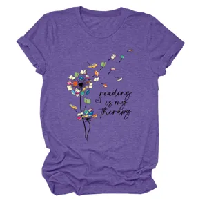 Close-up detail of the purple heather short sleeve t-shirt with book dandelion graphic.