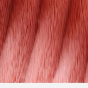 Close-up detail of soft pink coral fleece fabric showing plush texture and comfortable feel.