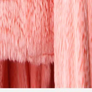 Close-up detail of the soft pink plush dry hair cap fabric, showing thick and absorbent texture.