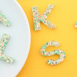 Christmas resin letter keychain with cute holiday cane and tree decorations for bags and keys.