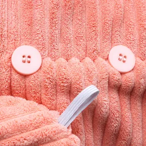 Coral fleece dry hair cap with double buttons and elastic loop for quick water absorption.