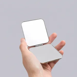 Portable folding double-sided pocket makeup mirror compact metal design for daily travel use.