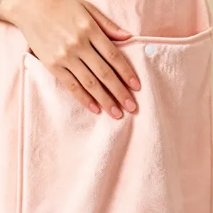 Pink wearable apron with detachable hand wiping towel, soft waterproof kitchen tool.