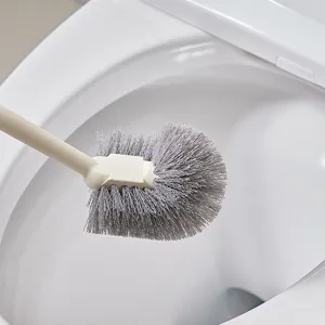 Household toilet brush with soft bristles and long handle for efficient bathroom cleaning.