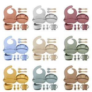 Complete baby silicone feeding set with divided plate, bib, bowl, cup, spoon and fork for toddlers.