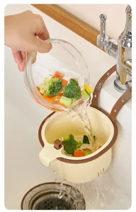 Close-up of a hanging kitchen sink strainer basket in action, filtering leftover food easily.