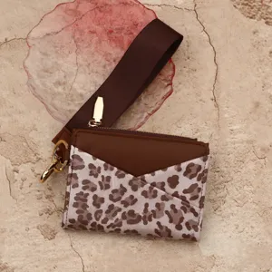 Chic leather card holder with wrist strap, cute leopard print design, compact women wallet.