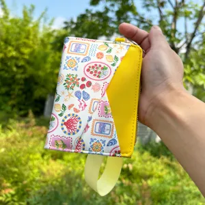 Women's leather card holder with wrist strap, colorful floral stamp print bifold purse.