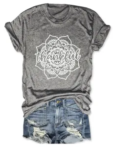Grey short sleeve t-shirt for women with thankful mandala graphic and denim shorts.