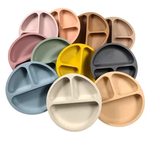 Detail view of silicone baby divided plates, multi-color assortment, soft material.