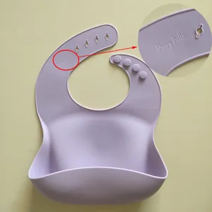 Light purple silicone baby bib with crumb catcher pocket and adjustable neck strap design.
