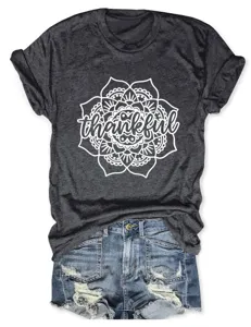 Dark gray graphic t-shirt featuring a white mandala print and thankful text detail.