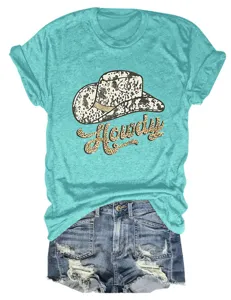 Close-up detail of casual turquoise t-shirt with cute cowgirl hat and Howdy graphic print.