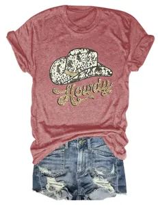 Close-up detail of women's western graphic tee with cow print hat and Howdy lettering.