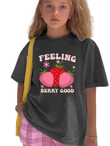 Detail view of children graphic t-shirt featuring strawberry print and cute slogan design.