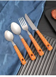Stainless steel flatware set featuring stylish orange wood-grain handles for modern dining.