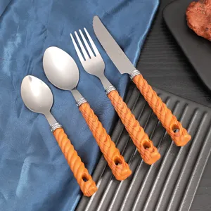 Stainless steel cutlery set with orange wood grain handles knife fork spoon for table